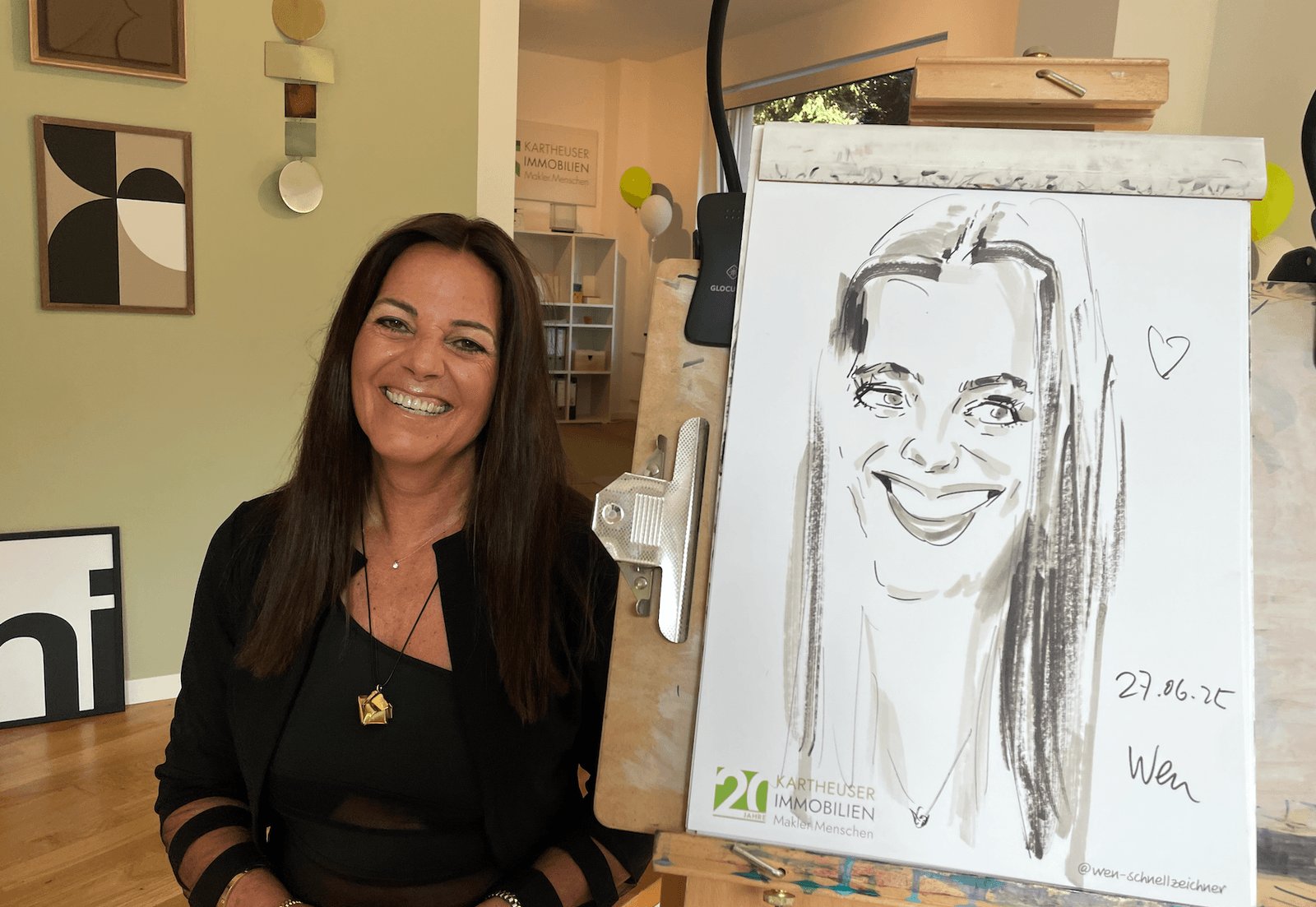 Trade show visitors receiving a live caricature at the booth