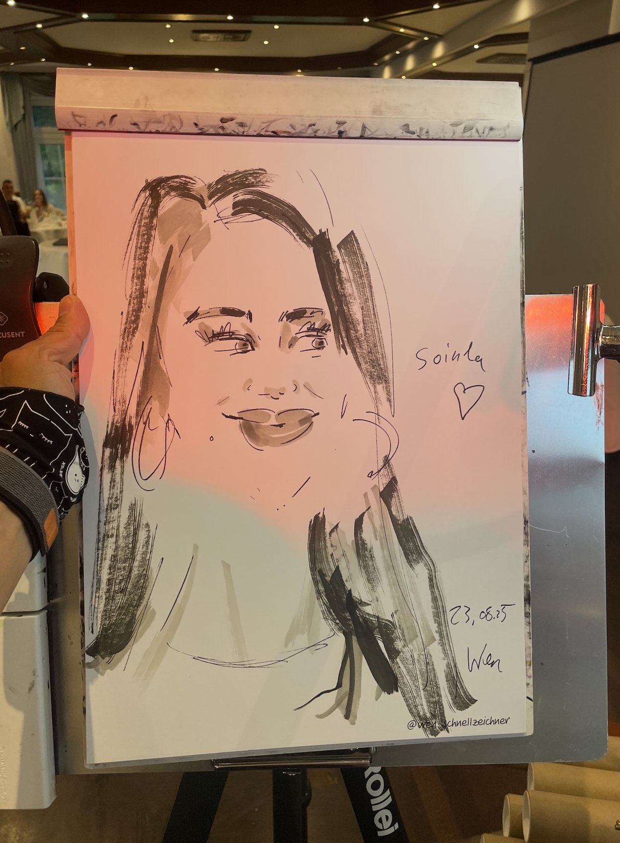 Live wedding drawing of a guest couple